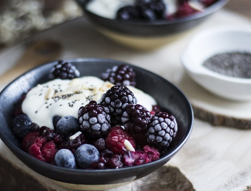 A bowl of blackberries and yoghurt